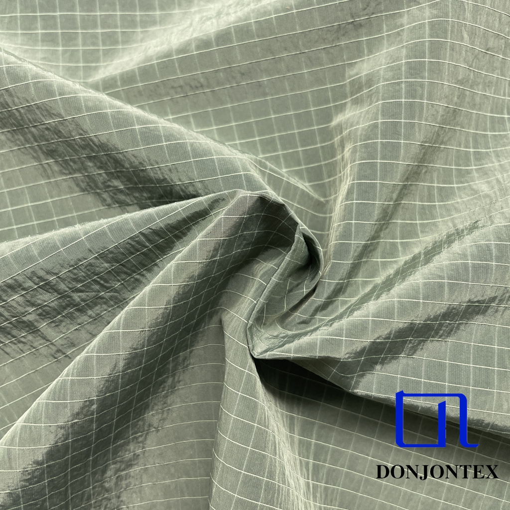 Hot Sale 100% Nylon 0.5x0.5 Ripstop Taffeta Fabric with Waterproof for Garment and Lining